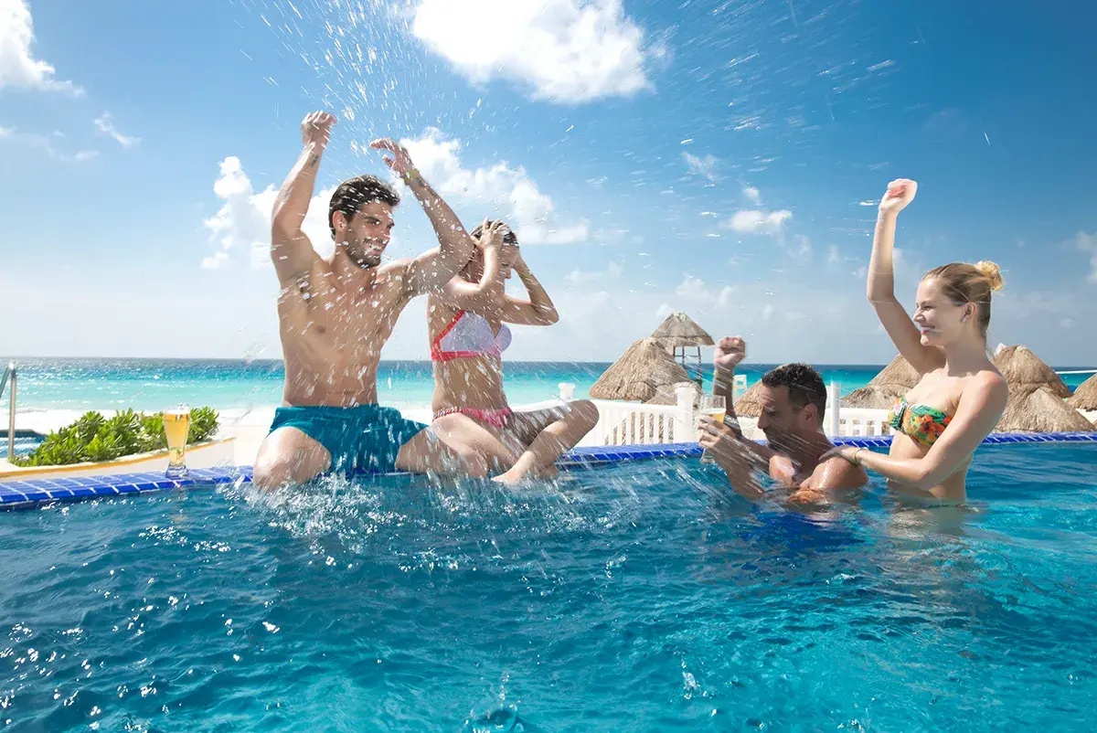 Adults-enjoying-the-pool-playing-volleyball